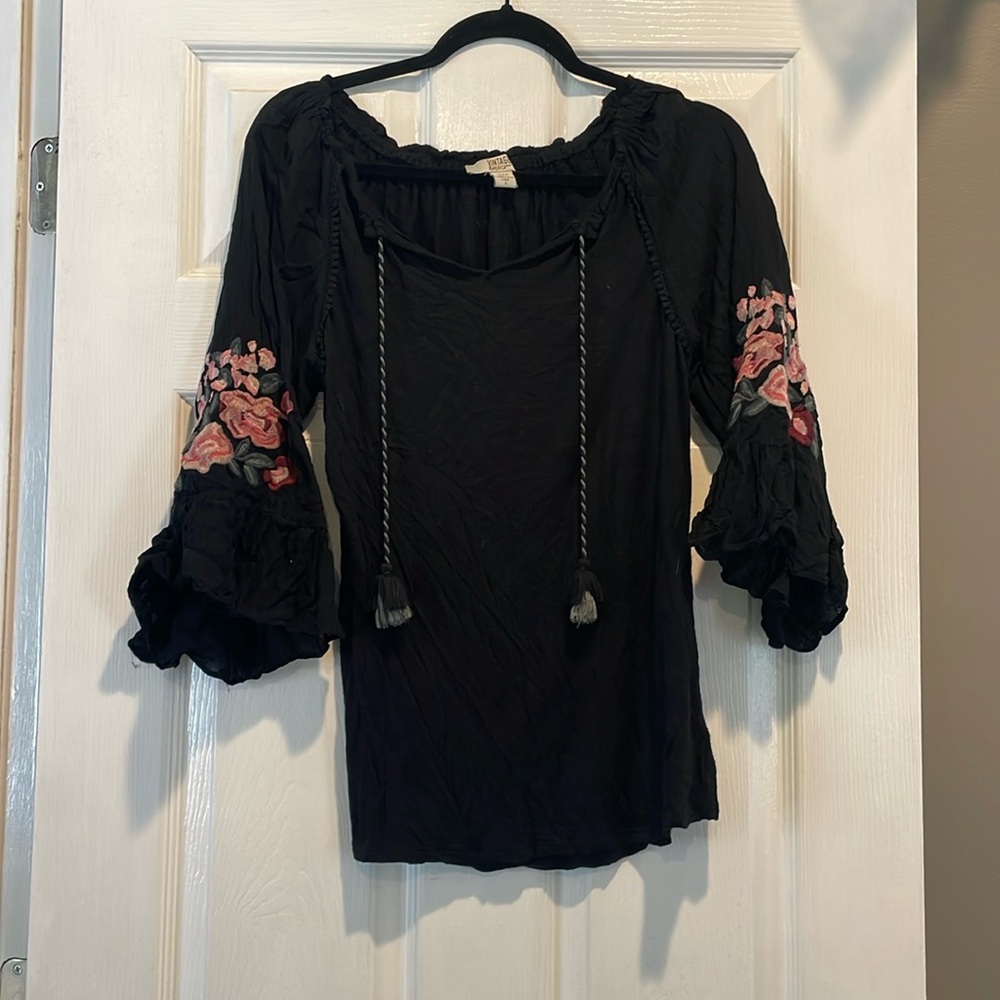 Black blouse with floral accent